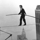 Petit makes his walk between the World Trade Center towers in 1974. Photo credit: Alan Welner/AP